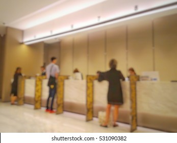 Blurred background front of bank counter.
