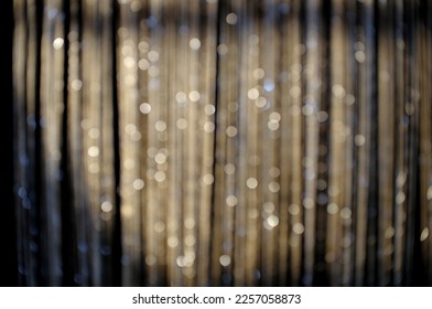 Blurred background and golden striped sheer curtain ornament  The backdrop can be applied for performance  romance    luxury themed visuals 