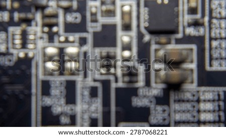 Blurred background of GPU electronic circuitry, showing abstract technology pattern and futuristic computer hardware texture.;