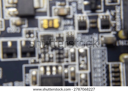 Blurred background of GPU electronic circuitry, showing abstract technology pattern and futuristic computer hardware texture.;
