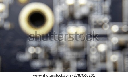 Blurred background of GPU electronic circuitry, showing abstract technology pattern and futuristic computer hardware texture.;