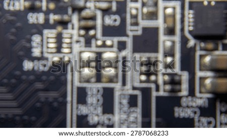 Blurred background of GPU electronic circuitry, showing abstract technology pattern and futuristic computer hardware texture.;