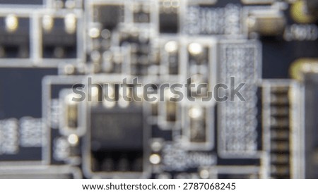 Blurred background of GPU electronic circuitry, showing abstract technology pattern and futuristic computer hardware texture.;