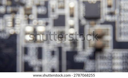 Blurred background of GPU electronic circuitry, showing abstract technology pattern and futuristic computer hardware texture.;