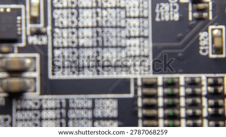 Blurred background of GPU electronic circuitry, showing abstract technology pattern and futuristic computer hardware texture.;