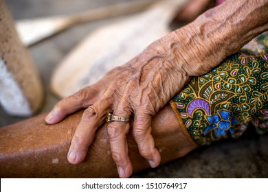 The blurred background of the hands of an old woman with muscle wrinkling, changing human body growth