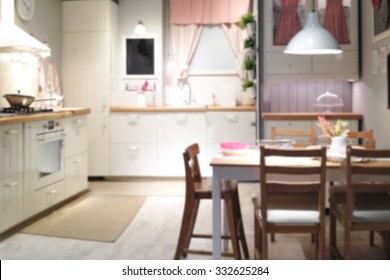 Blurred Background of home Kitchen with Light Bokeh.