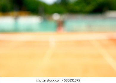 Blurred background image of beige tennis court