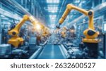 Blurred background of image showcases a high-tech factory floor featuring robotic arms engaged in precise assembly tasks, highlighting innovation and efficiency in manufacturing processes.