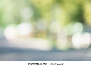 
Blurred background with an image of an urban view with trees and road - Shutterstock ID 1153952662