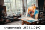 Blurred background of an inviting artist studio filled with colorful paints and canvases, showcasing a vibrant creative environment brimming with inspiration and artistic energy.