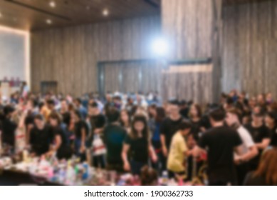 Blurred background of many people in the conference room