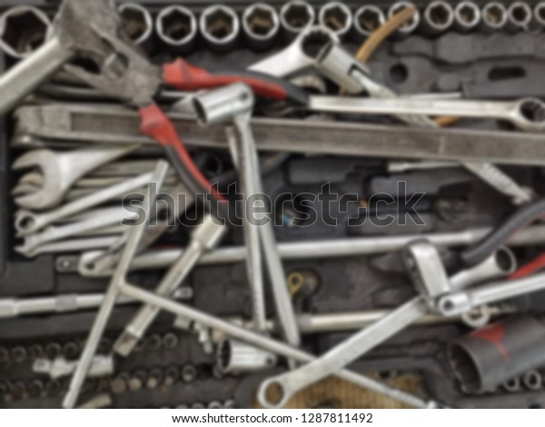 Blurred background of\
mechanic tools. 
