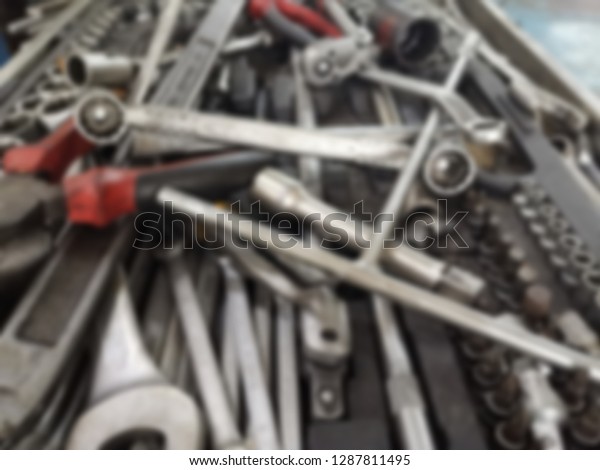 Blurred background of\
mechanic tools. 