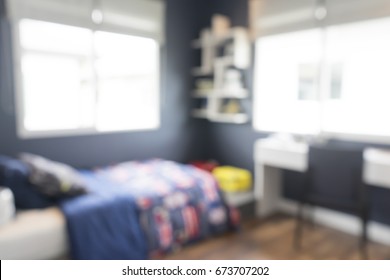blurred background of modern blue teenage bedroom