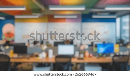 Blurred background of modern collaborative office space with colorful walls, whiteboards filled with ideas, and focused employees engaged in digital marketing strategy sessions