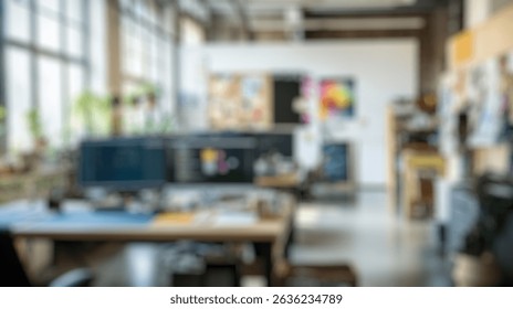 Blurred background of modern creative workspace with two monitors, inspiring decor, green plants, and organized materials for productivity and collaboration in a bright office environment