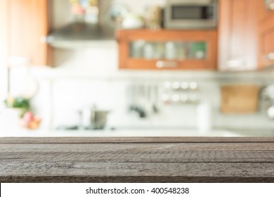 Blurred Background. Modern Kitchen With Tabletop And Space For You.