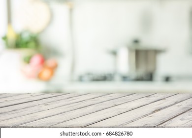 Blurred background. Modern kitchen with tabletop and space for you.