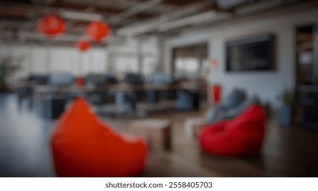 Blurred background of modern office interior with creative workspace, colorful bean bags, and technology displays for collaboration and innovation in a bright environment - Powered by Shutterstock