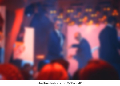Blurred for background. Night club dj party people enjoy of music dancing sound with colorful light with Smoke Machine and lights show. Hands up in earth. - Shutterstock ID 753575581