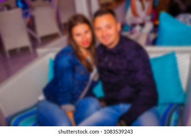 blurred for background night club. People smiling and posing on cam during concert in night club party. Man and woman have fun at club. Boy and girl at night club party - Shutterstock ID 1083539243