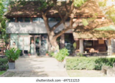 Blurred Background Of Outdoor Vintage Coffee Shop In Garden On Day Time.