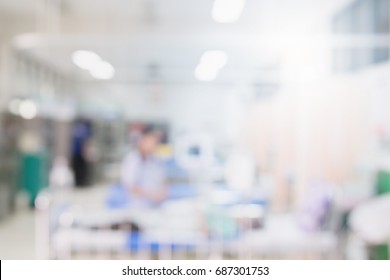 Blurred Background Patient In Hospital -abstract Blur Doctors And Nurses Are Busy With The Treatment Of Many Sick People In Emergency Or In Patient Room Background.