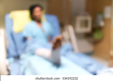 Blurred Background  Patients Broken Leg Lying On The Bed In  Hospital Room .