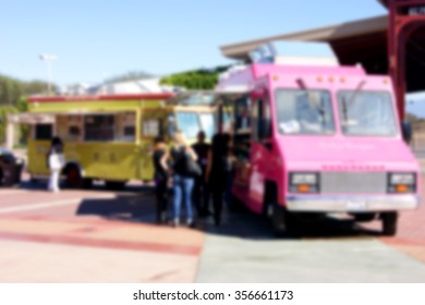 blurred background of people ordering at food truck - Powered by Shutterstock