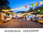 Blurred background : people shopping at market fair in sunny day, blur background with bokeh
