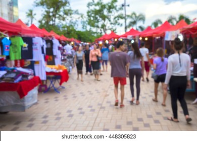 Blurred background : people shopping at market fair in sunny day, blur background with bokeh. in Lao market