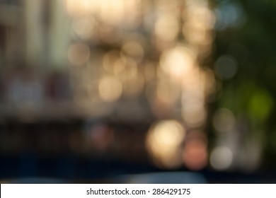 Blurred background photo.Cityscape bokeh. Defocused abstract city.Background out of focus.Can use as wallpaper, design. Summer blurry city backdrop.Travel out of focus photos. Fairy defocused photos.
