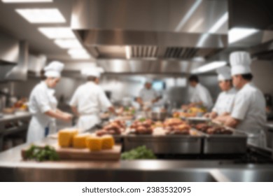 Blurred background of a professional kitchen of a restaurant or hotel with chefs and cooks - Powered by Shutterstock