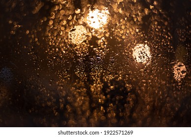 Blurred background with raindrops and lights.