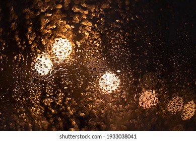 Blurred background with raindrops and lights.