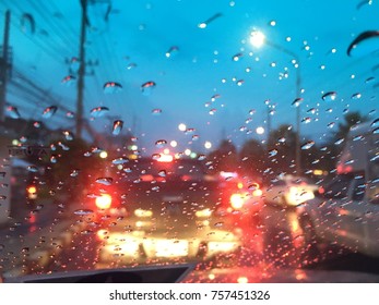 Blurred background, Raindrops on the windshield, street lights at night on a rainy day