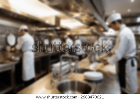 Blurred background a restaurant kitchen worker is working washing dishes after being used by customers.
