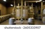 Blurred background of rustic winery interior featuring vintage equipment and wooden barrels for wine production and tasting experiences, capturing the essence of traditional winemaking techniques