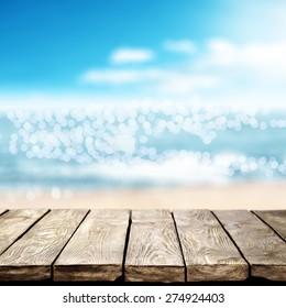 Blurred Background Of Sea Coast And Old Table Of Wood 