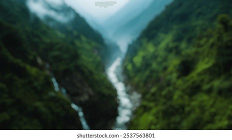 Blurred background of a serene winding river cuts through a rocky valley, surrounded by vibrant green mountains and mist. this landscape captures nature's breathtaking beauty and tranquility. - Powered by Shutterstock