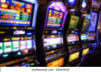blurred background of slot machines in casino                              