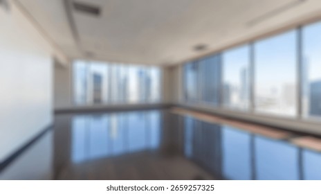 Blurred background of spacious empty office space featuring large panoramic windows with breathtaking city views, perfect for creative projects or corporate use in a modern urban setting.