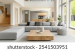 Blurred background of a spacious and modern living room featuring a large grey sofa, wooden coffee table, and ample natural light from large windows, creating an inviting atmosphere.