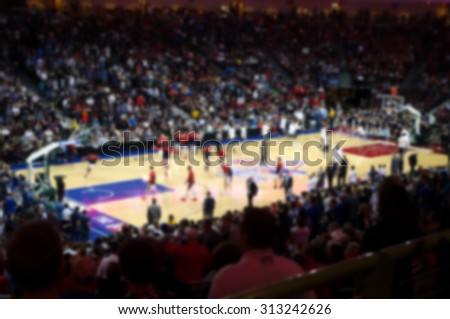  blurred background of sports arena crowd                              