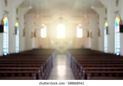 Blurred background of a surreal illuminated church aisle.
 - Shutterstock ID 588868961