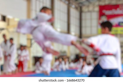 Blurred background of the Taekwondo kids athletes. Moment of athlete to warm up and strike an opponent during the tournament taekwondo kids - Shutterstock ID 1668643270