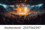 Blurred background of a thrilling professional wrestling event unfolds in a packed arena, showcasing an electrifying atmosphere filled with excitement and energy from enthusiastic fans.