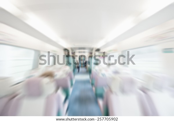 Blurred background of train carriage
interior. Suitable  as a background for most text colors including
white. Artistic intent with filters and
desaturation.