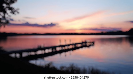 Blurred background of a tranquil lakeside scene captured during sunset, showcasing a wooden dock reflecting vibrant colors on calm waters, creating a serene atmosphere for relaxation. - Powered by Shutterstock